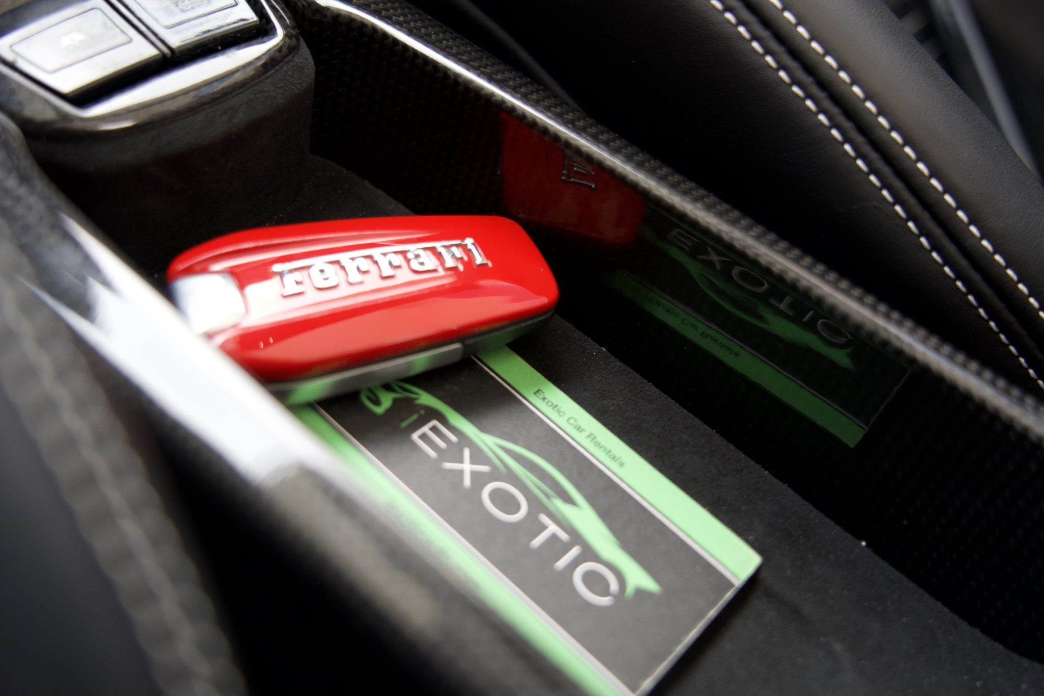 Ferrari 488 Spider key, symbolizing luxury and exclusivity for rentals in Houston.