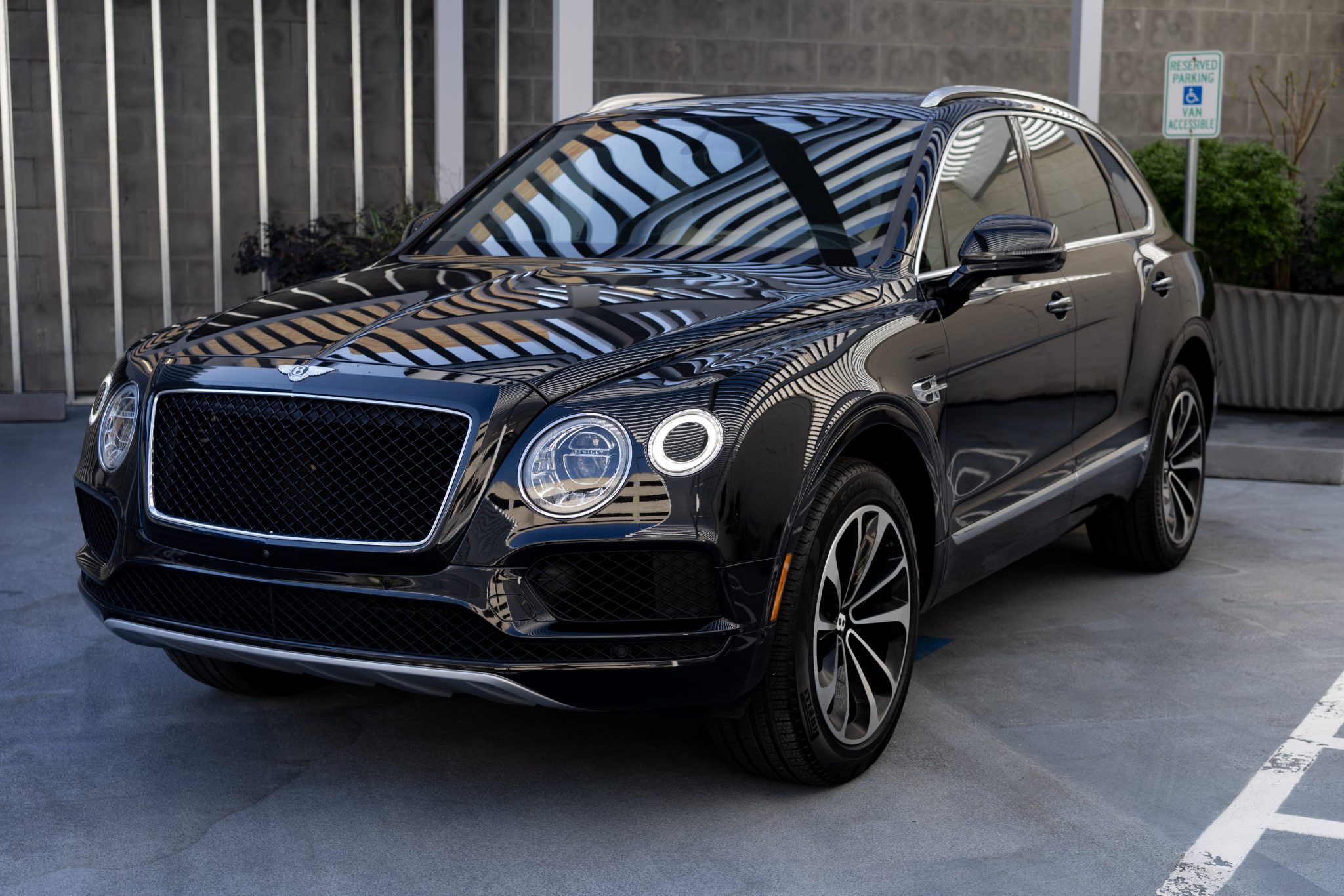 Bentley Bentayga driving in Houston – Luxury SUV rental for business and events.