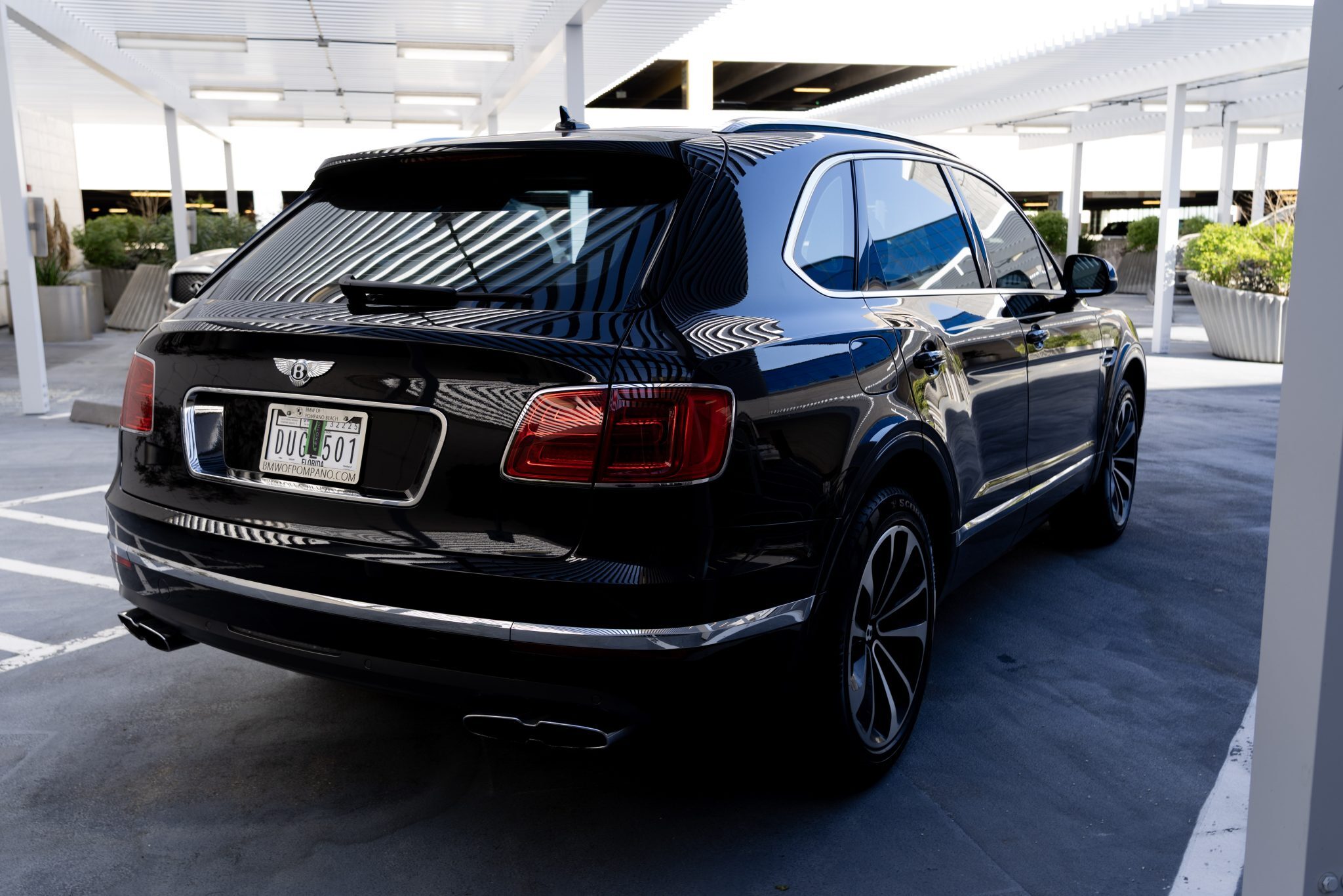 Bentley Bentayga rental in Houston – Luxury SUV with an elegant rear profile.