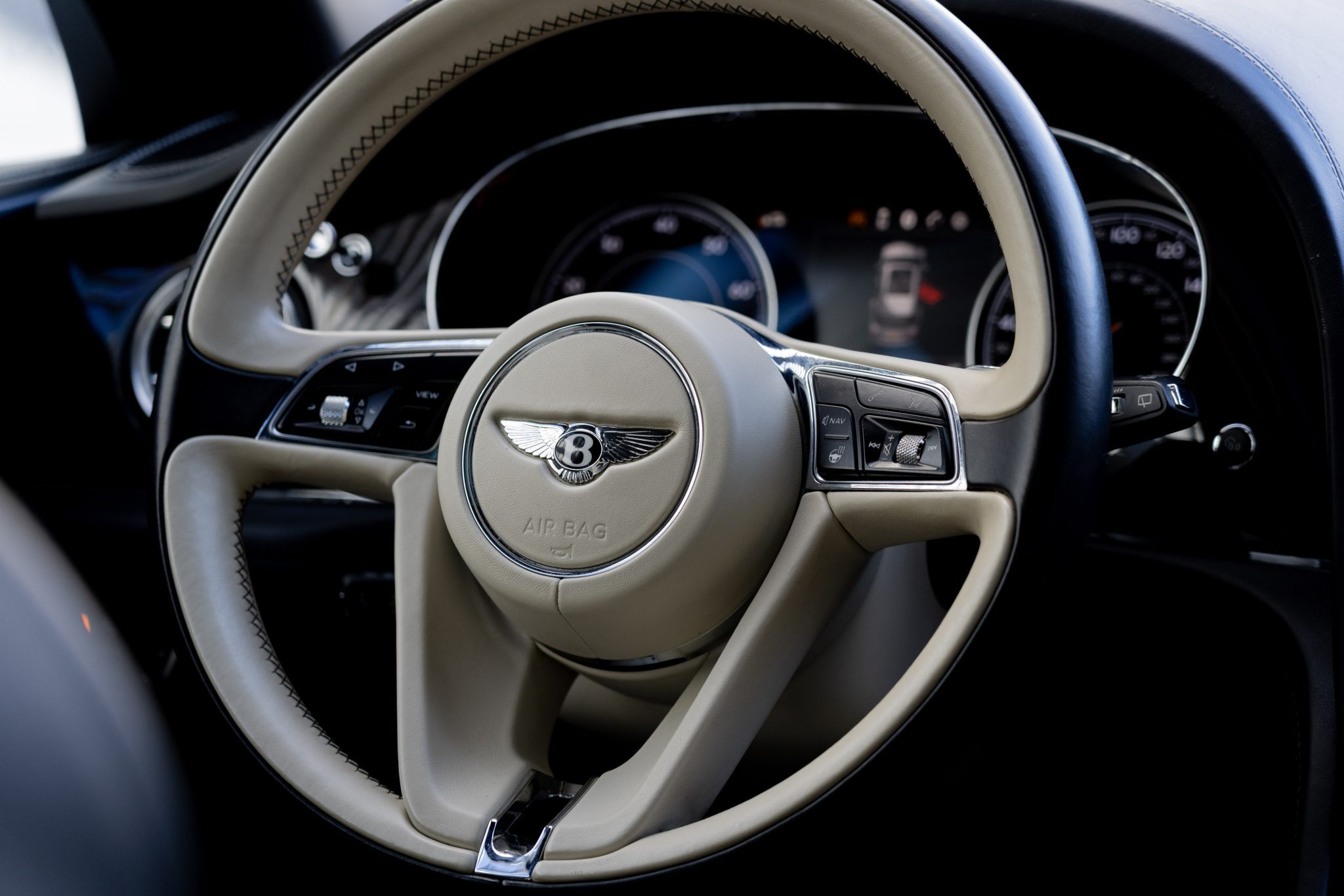 Bentley Bentayga luxury steering and digital display – SUV rental in Houston.