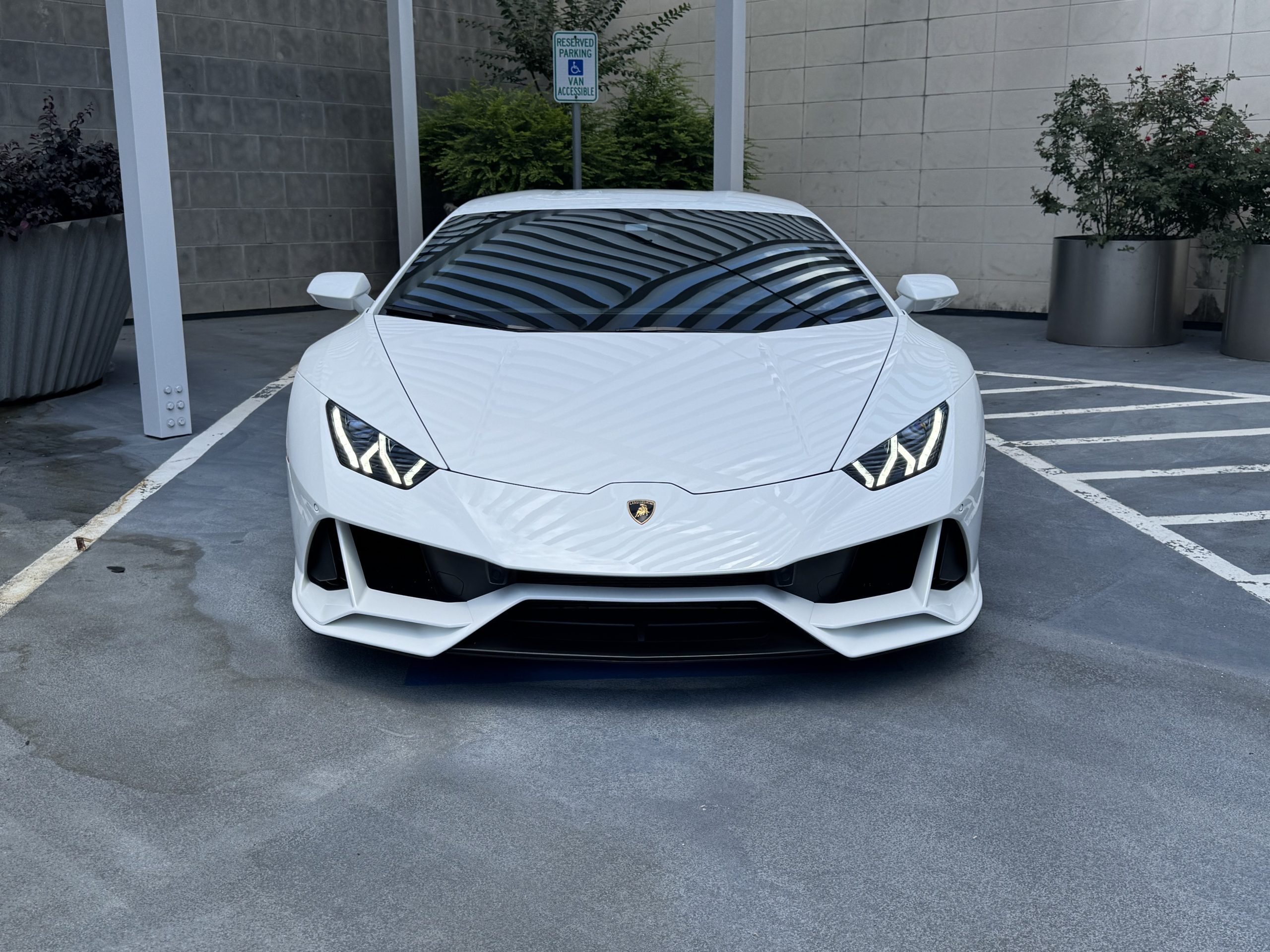 Lamborghini Huracan EVO frontal close-up showing logo and sharp hood contours