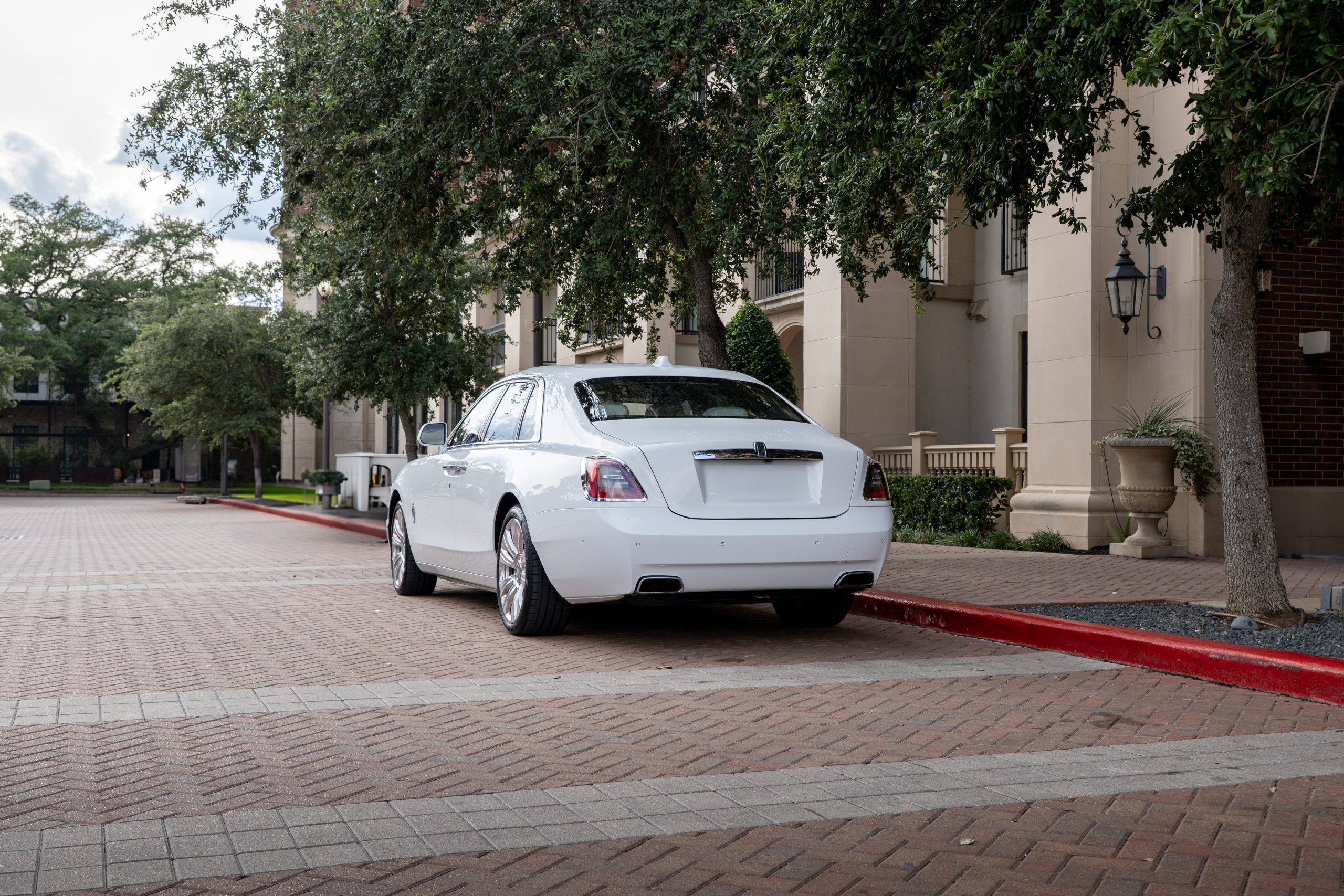 Luxury sedan shown from the rear side, perfect for wedding or event transportation in Houston.