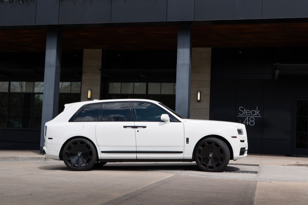 White Rolls Royce Cullinan parked at River Oaks District