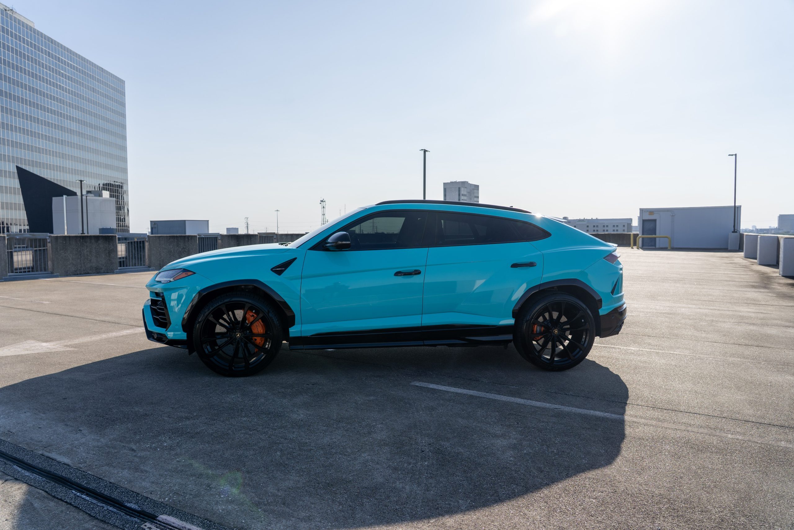 Turquoise Lamborghini Urus exterior Houston rental