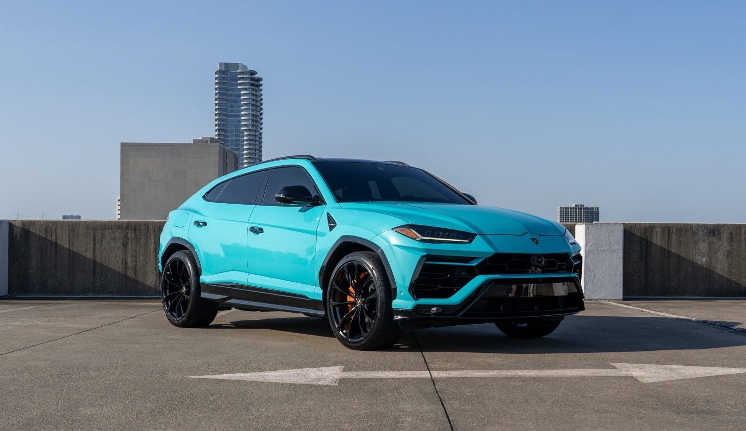Turquoise Lamborghini Urus front view Houston exotic rental