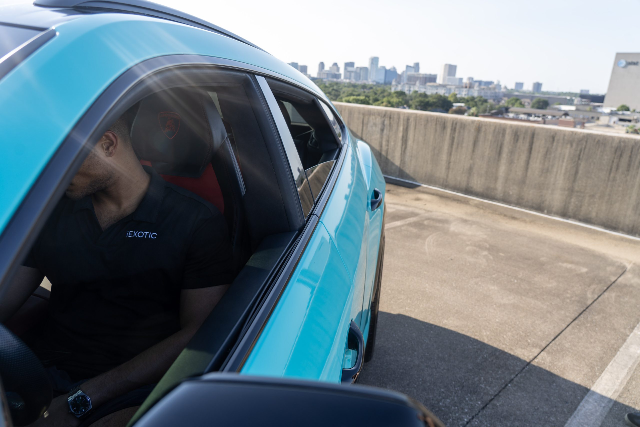 Turquoise Urus Houston skyline luxury rental
