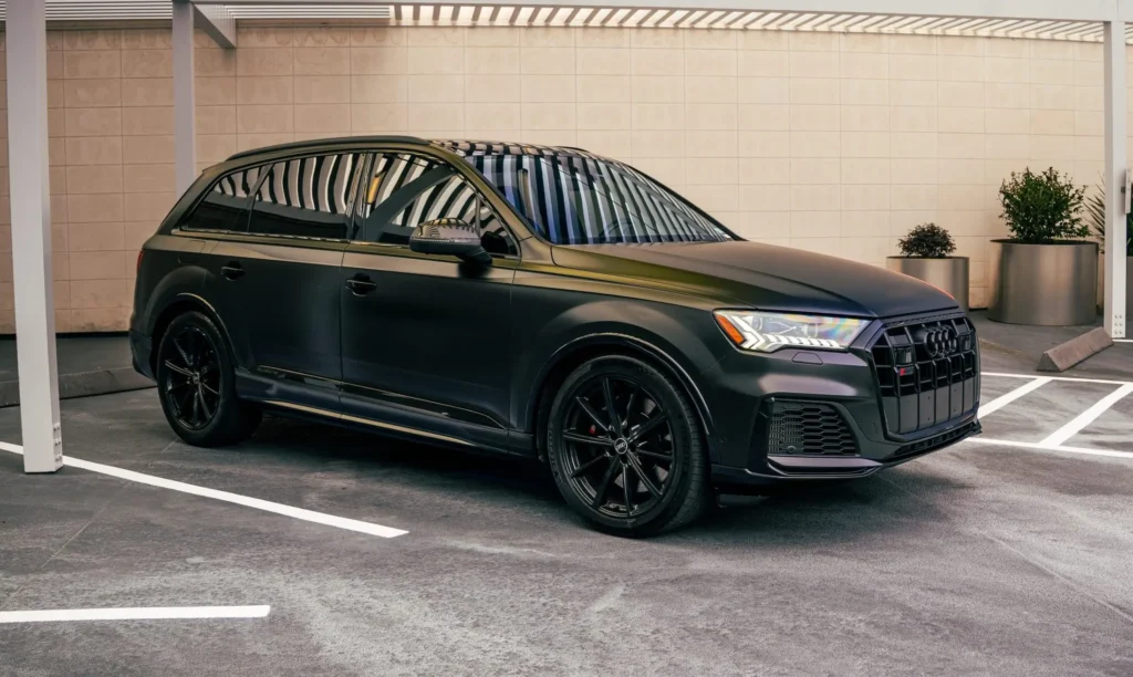Audi SQ7 full side profile matte black SUV Houston parking lot