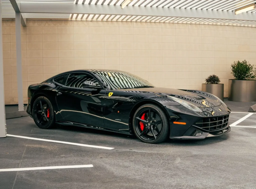 Ferrari F12 Berlinetta front three quarter view black Houston exotic car rental