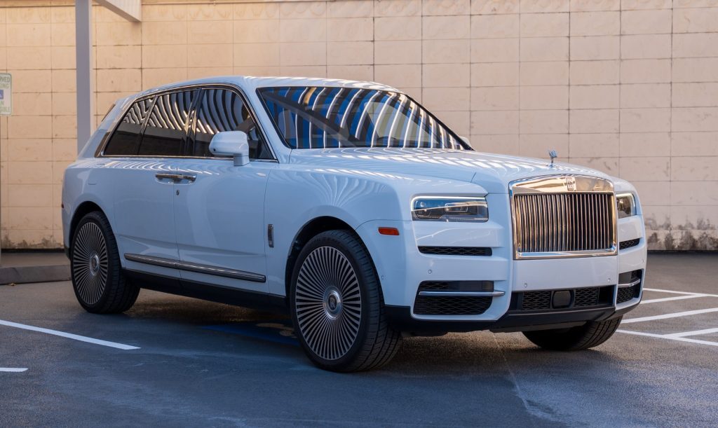 White Rolls Royce Cullinan rental Houston luxury SUV front three quarter view exotic car